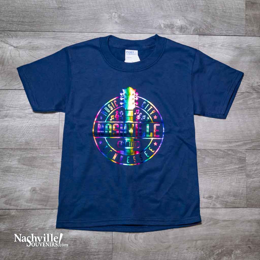 Our new design toddler "Music City Nashville Tennessee" T-Shirt features a colorful, reflective  logo that includes a multicolor guitar surrounded by music notes.  This shirt is available in either Navy or Granite and comes in toddlers sizes X-Small, Small, Medium and Large.