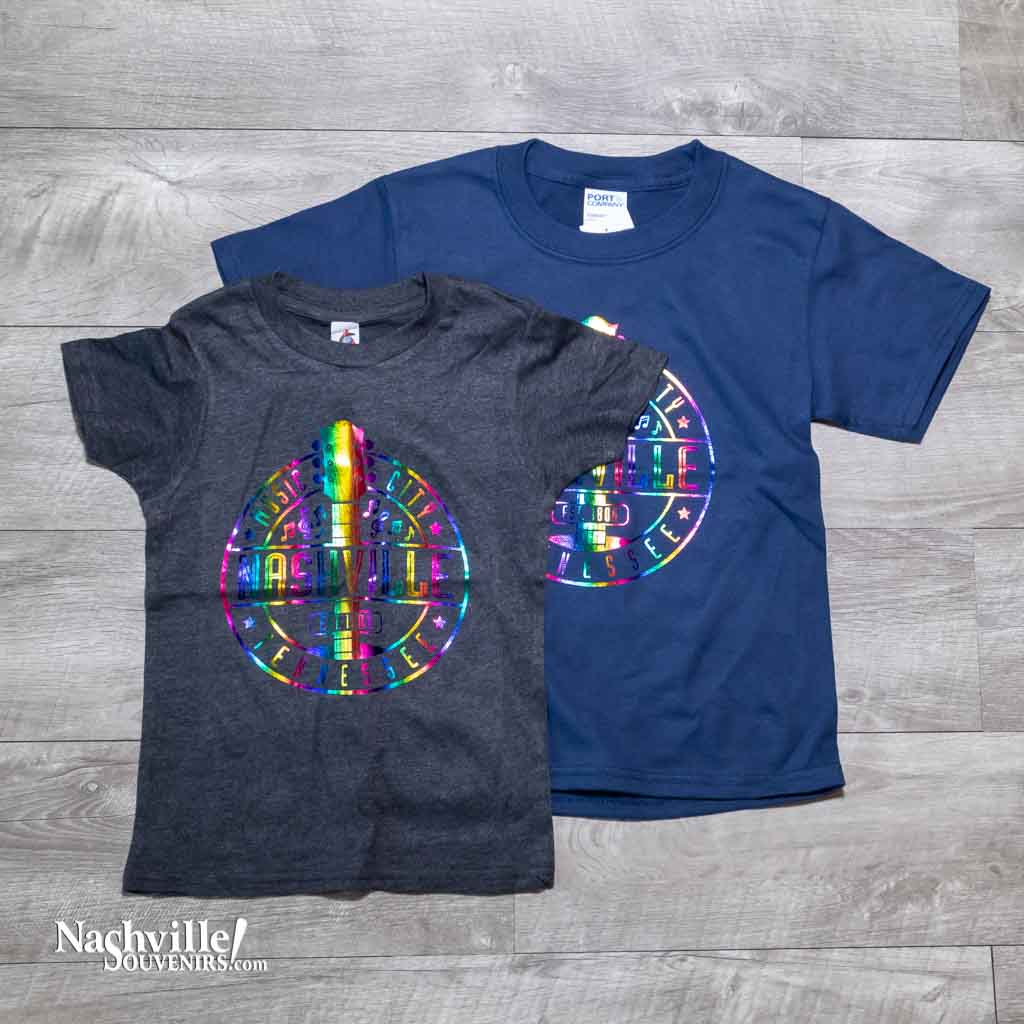 Our new design toddler "Music City Nashville Tennessee" T-Shirt features a colorful, reflective  logo that includes a multicolor guitar surrounded by music notes.  This shirt is available in either Navy or Granite and comes in toddlers sizes X-Small, Small, Medium and Large.