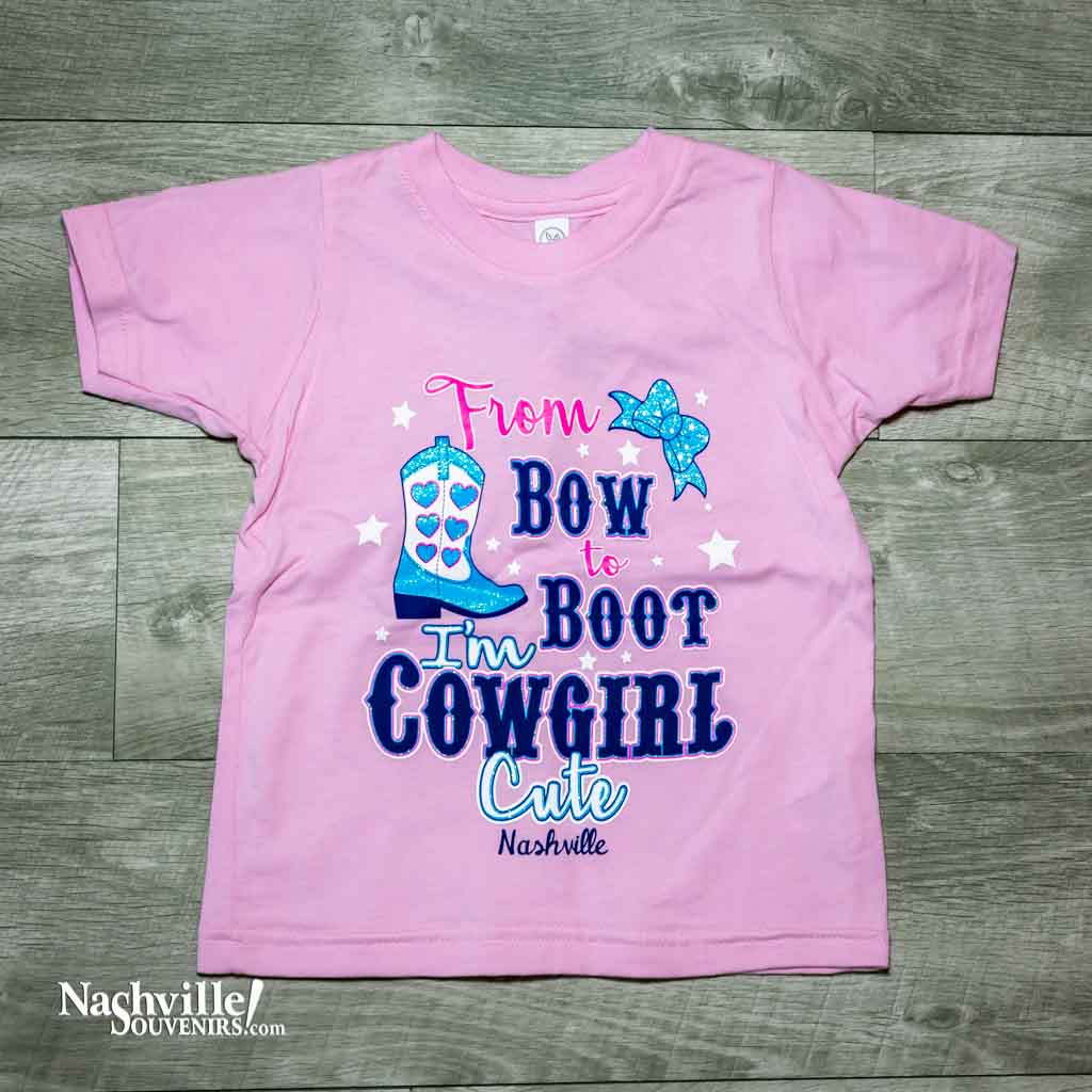 Our new design "I'm Cowgirl Cute Nashville" T-Shirt features a colorful logo that includes a cowgirl boot and a bow.  This shirt is available in pink and comes in toddler sizes 2T, 3T and 4T.