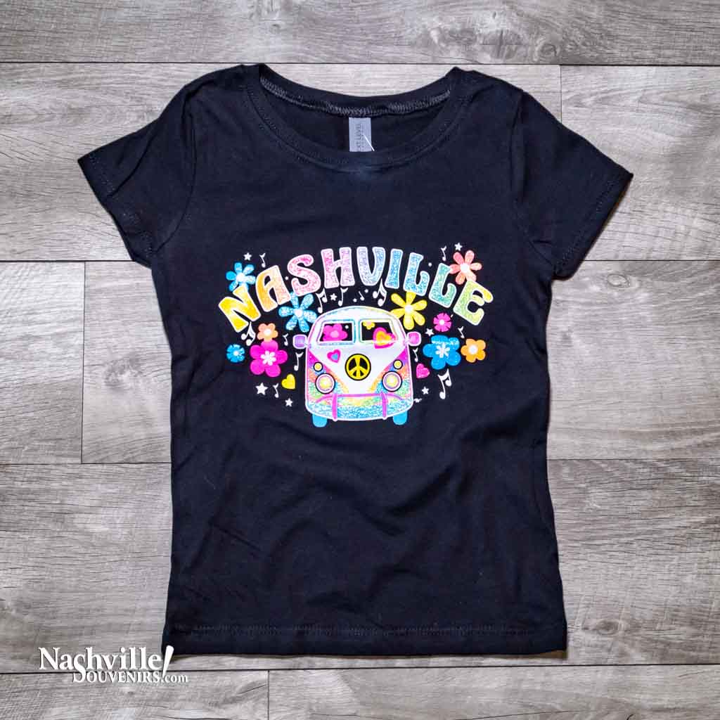 Our new design, youth "Flower Child Bus Nashville" T-Shirt features a colorful, glittery logo Nashville atop the front of an iconic VW love bus popular during the 70's.  This shirt is available in either Pink or Black and comes in youth sizes X-Small, Small, Medium and Large.
