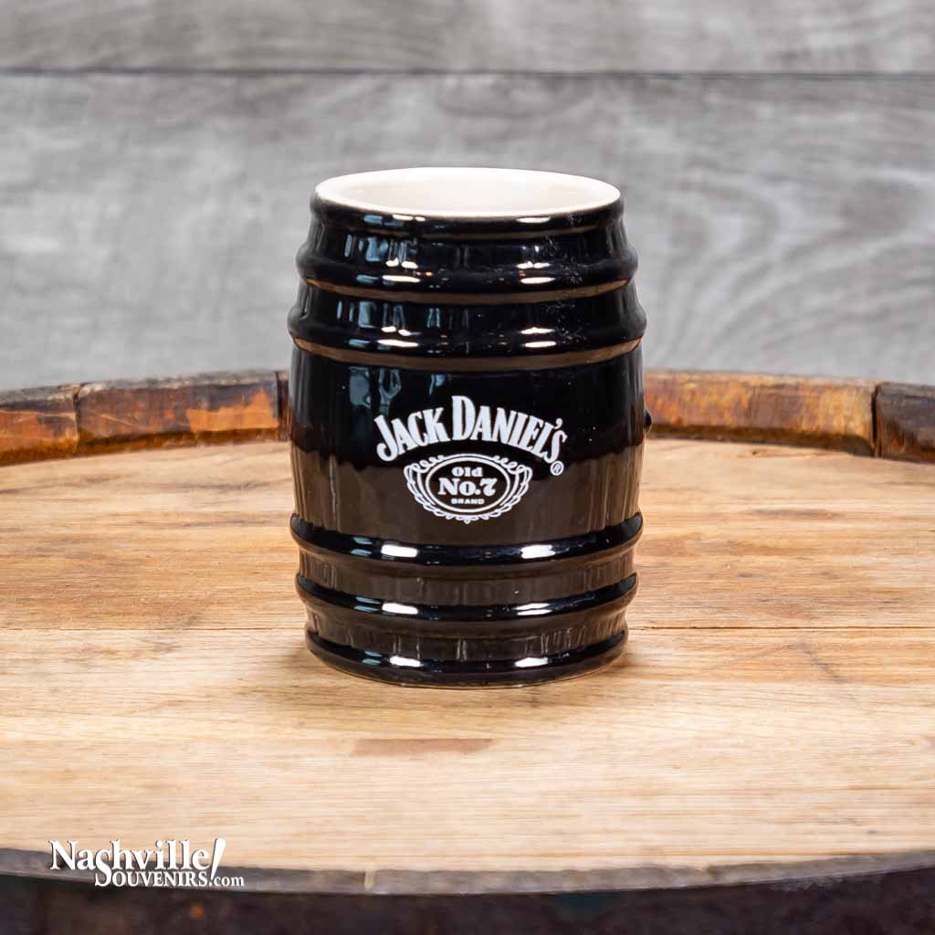 This collectible Jack Daniel's Black Barrel Stoneware Shot Glass is a new design for 2022 from Jack Daniel's. It features the famous Jack Daniel's Swing and Cartouche logo.  It is a 2.5 oz stoneware JD shot glass that has been crafted to resemble their iconic whiskey barrels housed in the famous Lynchburg, TN barrel houses. The shot glass is 3" tall.