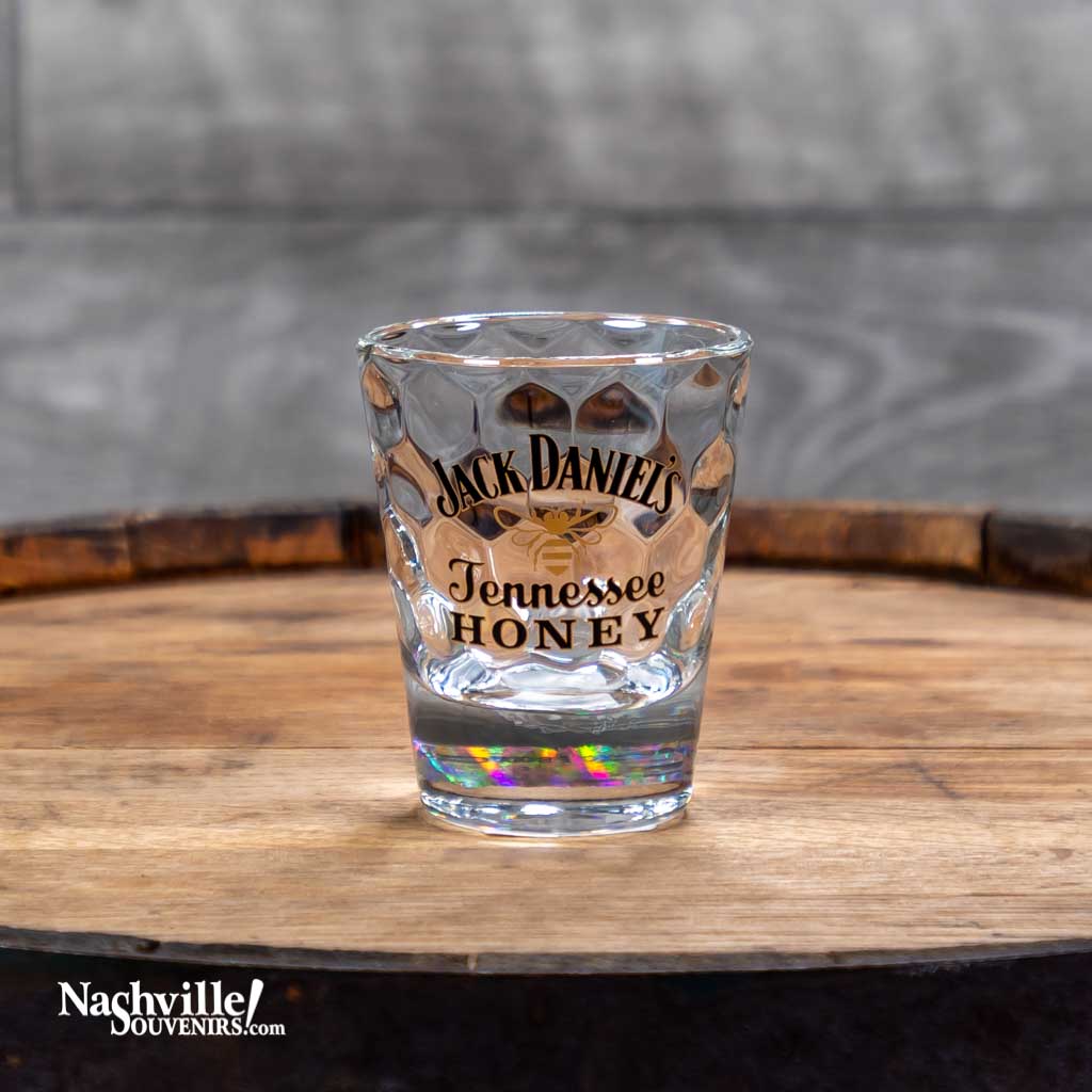 Officially licensed collectible Jack Daniel's Tennessee Honey Shot Glass is a great addition to your JD barware. It features the iconic Honey Bee Jack Daniel's logo.  This 2.5 ounce vintage look, old style Jack Daniel's collectible shot glass improves the look of any bar, man cave or party.