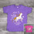A colorful and sparkly design that reads, "Believe in the Magic of Music Nashville" Toddlers T-Shirt. A Flying horse with gold glitter design and matching stars on a bright pink or purple t-shirt.