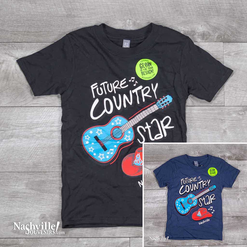 A great new glow in the dark design featuring a big bold blue and red guitar and Cowboy hat. Along with those images, printed in big letters are the words "Future Country Star Nashville". 